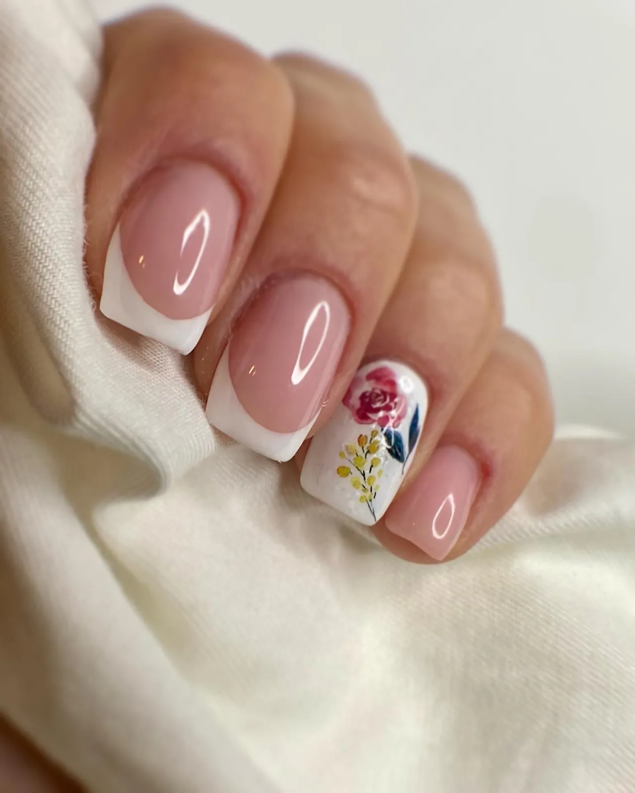 Square French nails with a hand-painted rose accent